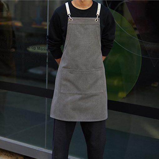 Tablier en toile avec bretelles croisées en coton et en cuir