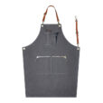 Tablier en denim gris avec bretelles croisées en cuir